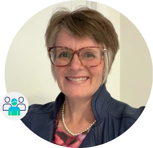 Professional headshot of a smiling woman wearing glasses, a navy jacket and a pearl necklace, with a team icon overlay representing leadership or staff.