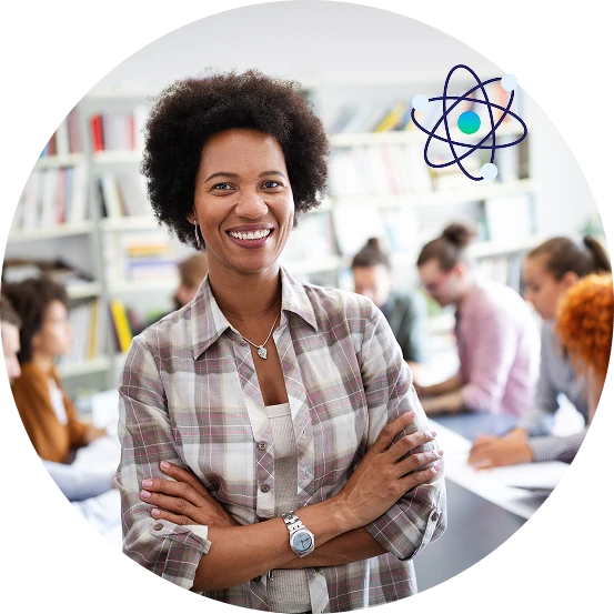 Smiling educator standing confidently in a learning environment with participants collaborating in the background, representing education, training, and professional development.
